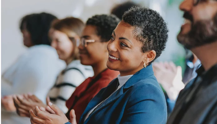 Women Clapping in the Meeting